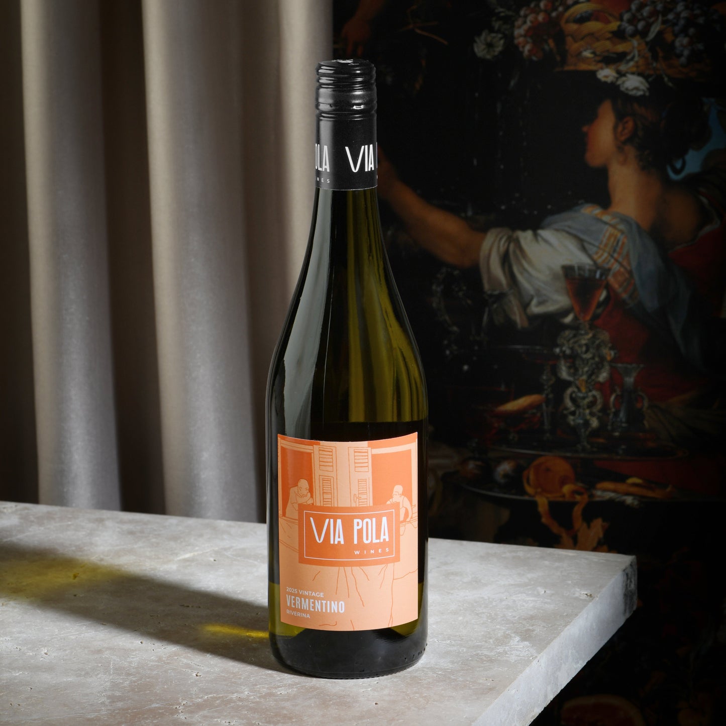 Wine bottle with a label on a table with a dark background